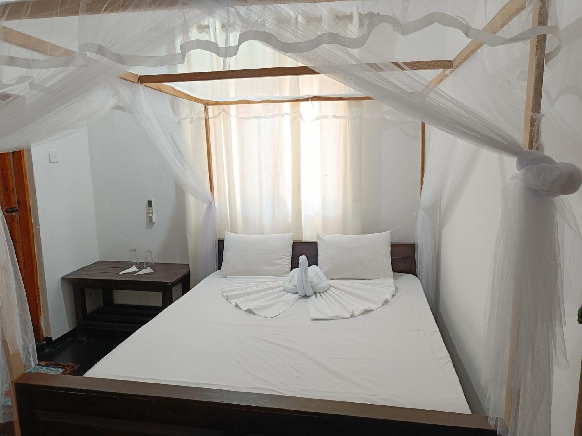 Kingly Aroma Hotel อารูกัมเบย์ ห้อง รูปภาพ